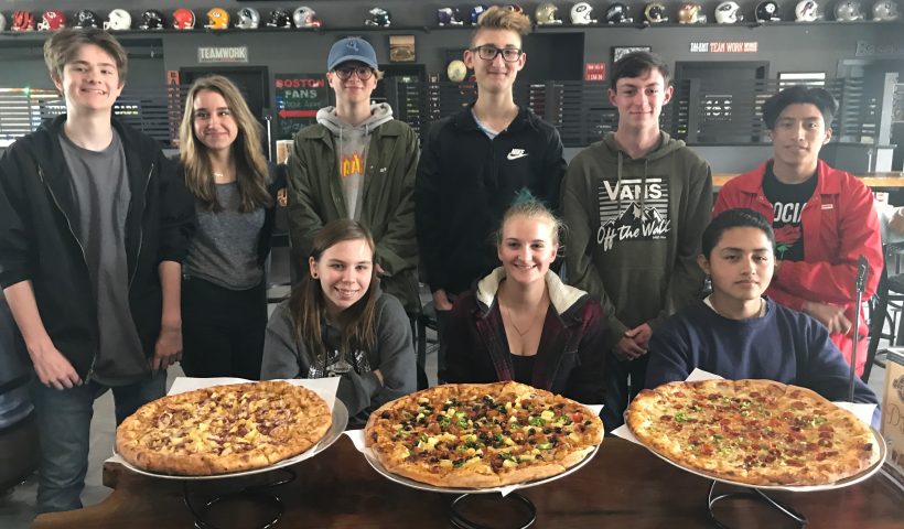 students with pizzas